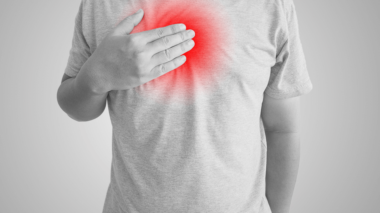 Person experiencing chest pain from acid reflux
